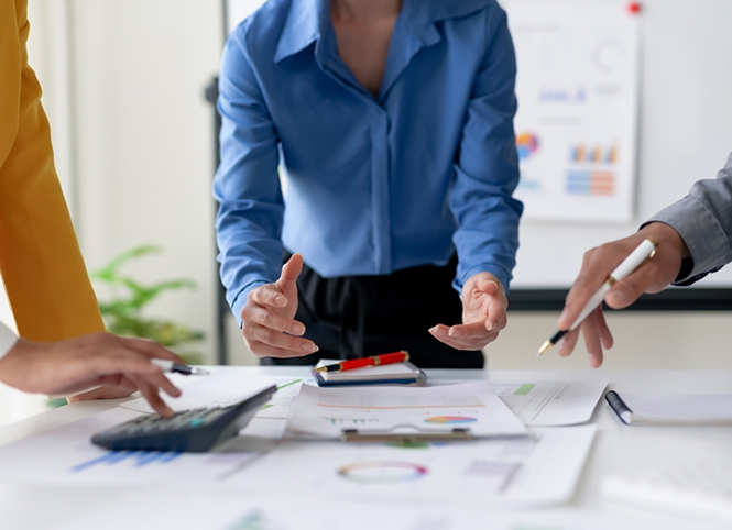 Financial planners collaborating at a desk